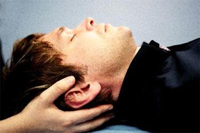 Cranio Sacral Therapy. hands under head